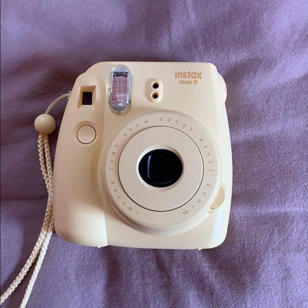 yellow polariod canera